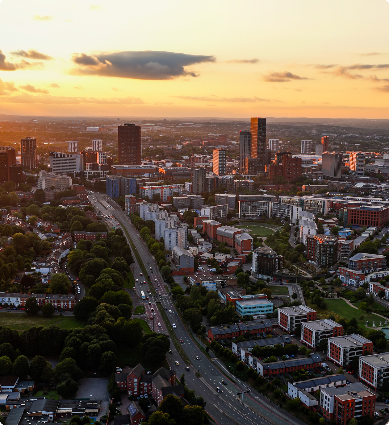 Cityscape at sunset with tall buildings